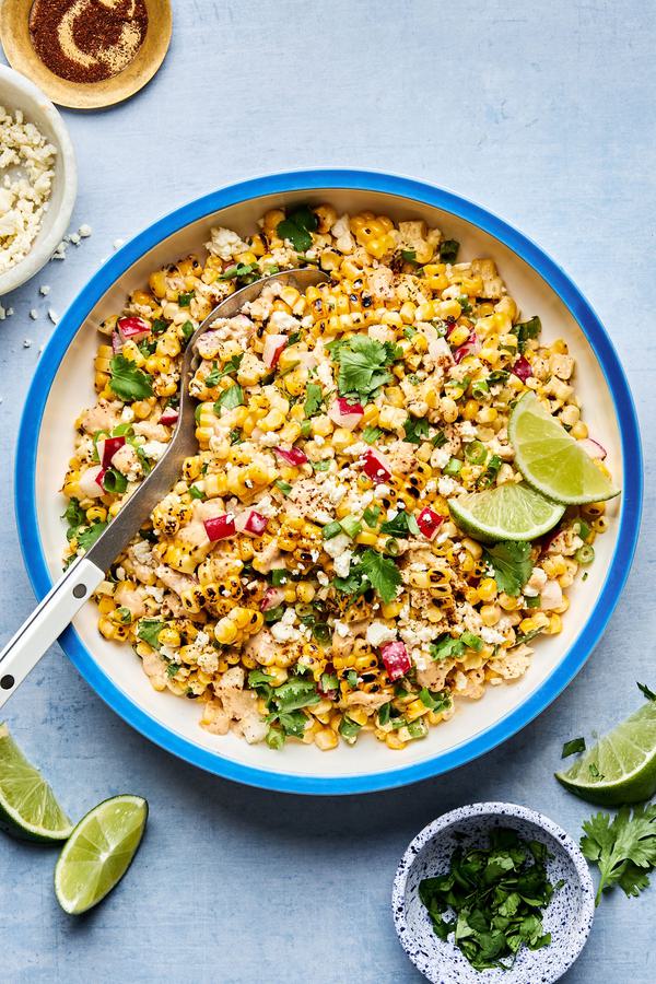 mexican street corn salad made with radishes, green onions, cilantro, cotija, lime juice, salt, pepper and chipotle mayo