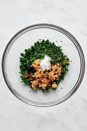 Boiled then chopped mint leaves, brown sugar, vinegar and salt in a bowl