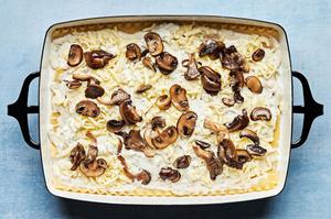 mushroom lasagna with layers of homemade white sauce, lasagna noodles, ricotta, mozzarella & mushrooms ready for the oven