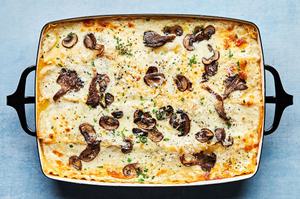 homemade mushroom lasagna fresh from the oven topped with pepper, Parmesan and parsley