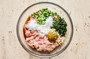 chicken, basil, garlic, green onions, fish sauce, curry paste, sugar, cornstarch, and salt in a glass bowl