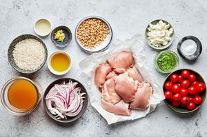 skinless chicken thighs, rice, olive oil, red onion, pesto, lemon zest, lemon juice, goat cheese & pie nuts in prep bowls
