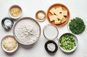 flour, baking powder, baking soda, salt, and minced onion, butter, Parmesan, buttermilk chives & green onions in prep bowls