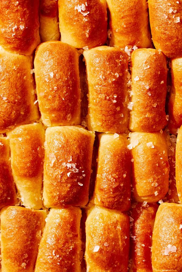homemade parker house rolls brushed with butter and sprinkled with flaky salt