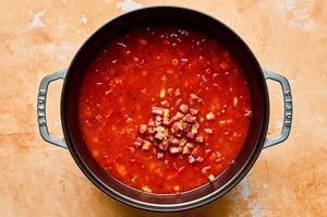 homemade pasta e fagioli soup with pancetta, cannellini beans and pasta noodles cooking in a pot