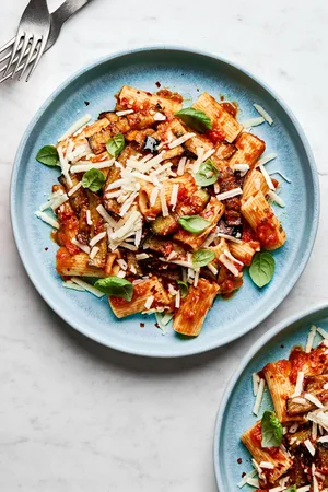 Sicilian Pasta alla Norma: Traditional eggplant pasta with tomato sauce, ricotta salata, garlic, oregano, salt & chili flakes