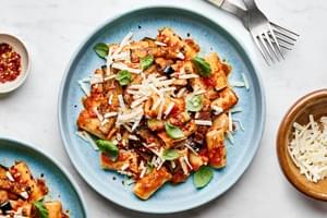 Sicilian comfort food: Plated Pasta alla Norma with fried eggplant, ricotta salata, chili flakes & herbs