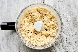 biscuit dough in a food processor made with flour, baking soda, salt, sugar and butter