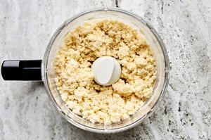 biscuit dough in a food processor made with flour, baking soda, salt, sugar and butter