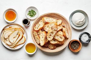 baguette slices, pear, burrata, honey, olive oil, sherry vinegar, salt, pepper and thyme leaves in prep bowls