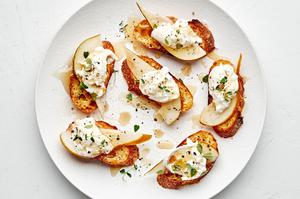Pear and Burrata Crostini drizzled with sherry vinegar and honey and sprinkled with thyme, salt and pepper