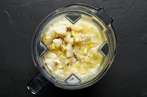 pear and buttermilk bisque being blended in a blender
