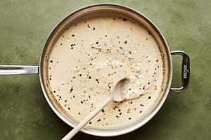 lemon sage cream sauce in a skillet made with butter, shallot, garlic, sage, cream, stock, Parm, lemon zest & juice & pepper