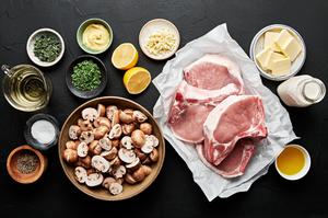 4 pork chops, butter, cream, mushrooms, salt, pepper, lemon, mustard, olive oil, thyme and white wine