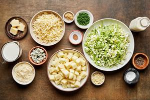 potato, leeks, Gruyère, parmesan, blue cheese, butter, cream, spices and ground mustard in prep bowls