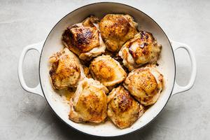 8 bone in skin on chicken thighs seasoned with salt and pepper browned in olive oil in a pan
