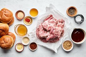 pork shoulder, apple cider vinegar, chicken stock, brown sugar and spices in prep bowls to make pulled pork