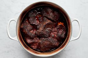 pork shoulder cooking in a pot