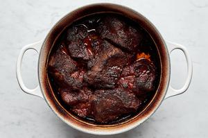pork shoulder cooking in a pot