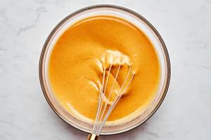 pumpkin, condensed milk, eggs, egg yolk, vanilla and spices whisked together in a glass mixing bowl