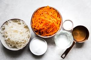 Julienned carrots and daikon radishes, sugar, vinegar salt and water