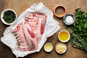 rack of lamb, salt, pepper, garlic, parsley, rosemary, olive oil and vegetable oil in prep bowls