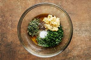 garlic, parsley, rosemary, olive oil, salt and pepper in a glass bowl