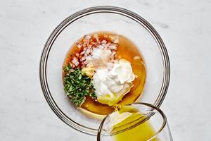 sherry vinegar, minced shallot, fresh thyme, mustard, honey, Creme Fraiche, olive oil,  and salt in a glass bowl