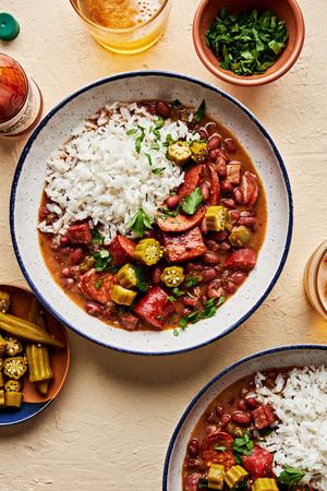 a bowl of homemade red beans rice made with andouille and hot Louisiana sausage and ham hock