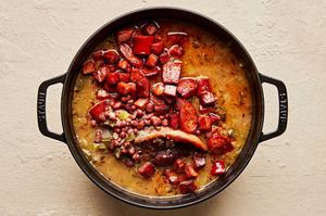 a pot of homemade red beans rice made with andouille and hot louisiana sausage, ham hock, peppers, onions and spices