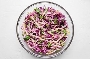 red cabbage and apple slaw made with red onion, cilantro, mint, jalapeño, lime zest and juice, mayo, salt and pepper