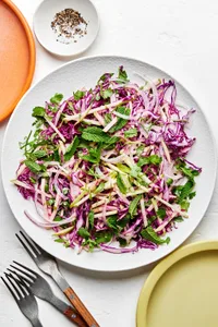 red cabbage and apple slaw made with red onion, cilantro, mint, jalapeño, lime zest and juice, mayo, salt and pepper