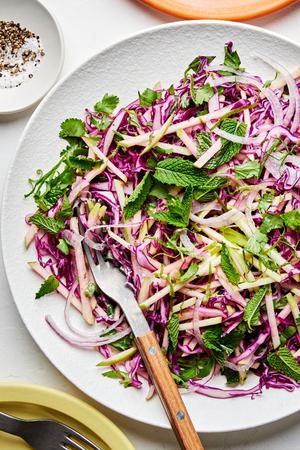 red cabbage and apple slaw made with red onion, cilantro, mint, jalapeño, lime zest and juice, mayo, salt and pepper