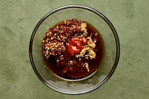 fish sauce, brown sugar, sriracha, red pepper flakes, sesame oil and rice vinegar in a glass bowl