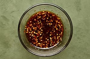 fish sauce, brown sugar, sriracha, red pepper flakes, sesame oil and rice vinegar whisked together in a glass bowl