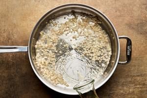shallots cooking in olive oil in a skillet