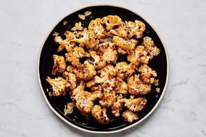 roasted cauliflower florets seasoned with olive oil, salt, garlic powder, smoked paprika, red pepper flakes, and Parmesan