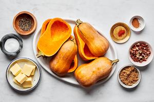 honeynut squash, butter, cinnamon, salt, cayenne, pecans and black pepper in prep bowls