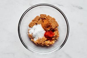 sugar, salt, cinnamon, and cayenne mixed together in a glass bowl