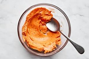 tomato compound butter in a bowl made with butter, tomato paste, brown sugar, garlic powder, oregano, and salt for salmon