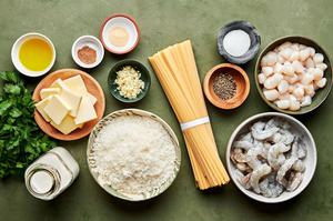fettuccine, butter, olive oil, garlic, spices, shrimp, scallops, heavy cream, Parmesan and parsley