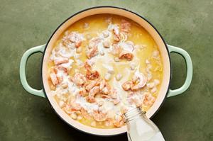 butter, garlic, garlic powder, nutmeg, salt, and pepper scallops, shrimp and cream cooking in a skillet