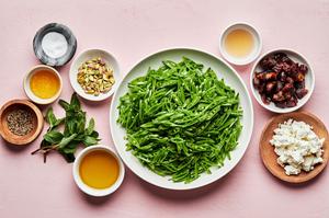 snap peas, dates, pistachios, mint leaves, goat cheese, olive oil, apple cider vinegar, salt, pepper and honey in prep bowls