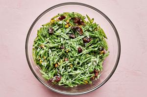 shaved snap pea salad with goat cheese, dates, pistachios and mint tossed with a goat cheese dressing