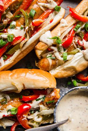 Italian hero sandwiches on a plater with honey mustard