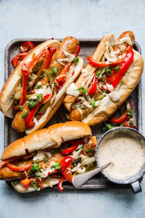 Italian hero sandwiches on a plater with honey mustard