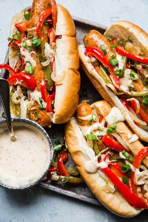 Italian hero sandwiches on a plater with honey mustard