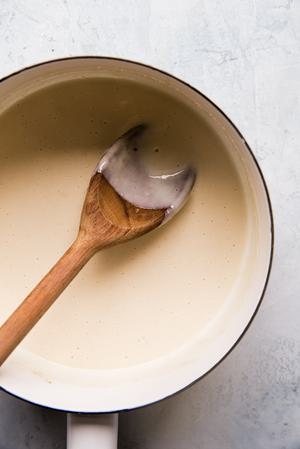provolone cheese sauce in a small pot