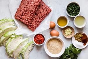 ground beef, harissa, garlic, olive oil, spices, cabbage, bread crumbs, eggs, olive oil parsley.