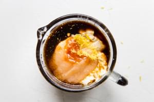 ketchup, horseradish, Worcestershire sauce, mustard, hot sauce, apple sauce, and lemon zest being mixed in a bowl